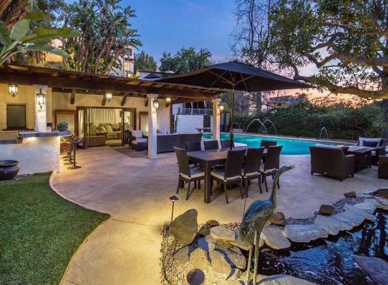 Member of Queens of the Stone Age records a home sale. Woodruff